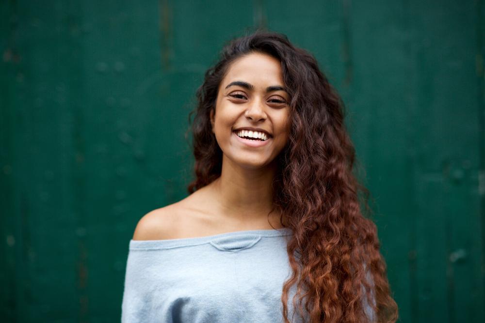 woman smiling after getting teeth whitened