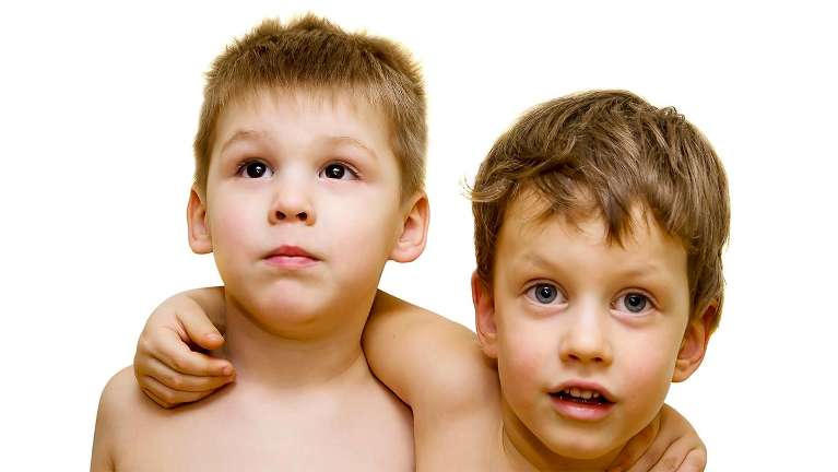 Two little boys smiling